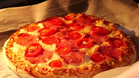 Baking pizza in an electric oven, taking the pizza out of the oven. Stock Footage 306236923