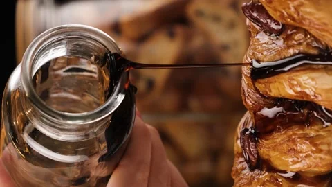 Baking is poured with maple syrup vertical video Stock Footage 260867732