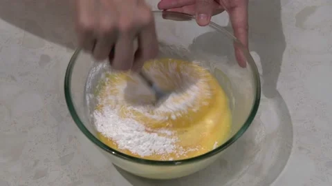 Baking powder is added to the cake dough Stock Footage 164500532