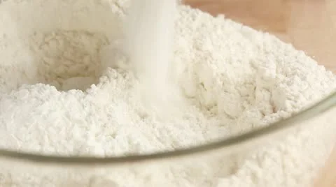 Baking powder being added to flour Stock Footage 24657109
