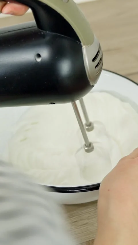 Baking preparation shows mixer with white cream in bowl during cooking at home Stock Footage 319068085