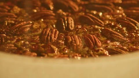 Baking process of pecan pie in home oven in kitchen, time lapse Stock Photos