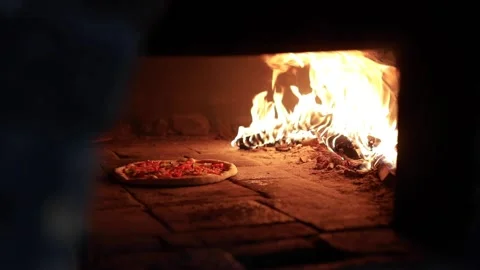 Baking process of vegetarian pizza in a stone oven Stock Footage 143938516