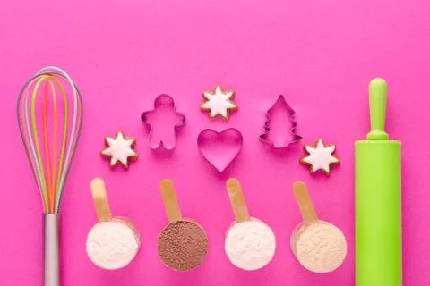 Baking protein with kitchen tools and cookie cutter on pink background Stock Photos