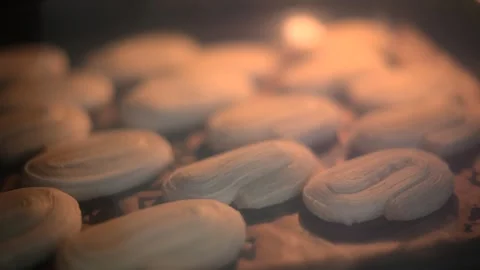 Baking puff pastries in the oven in accelerated mode. Timelapse Stock Footage 292496739
