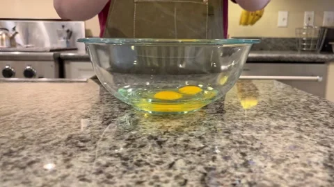 Baking Pumkin Bread Cracking Egg into Bowl 2 Stock Footage 320086750