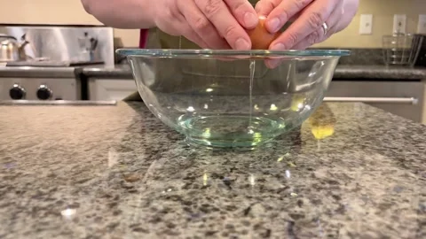 Baking Pumkin Bread Cracking Egg into Bowl 1 Stock Footage 320086776