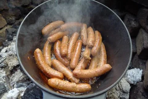 Baking sausages in the garden Stock Photos