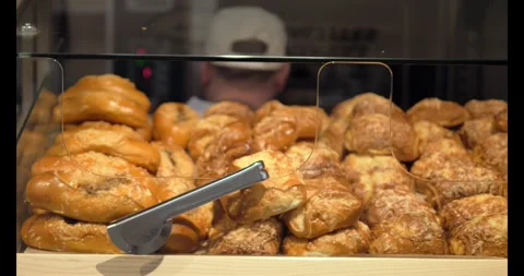 Baking scenes capture attention as fresh Baking emerges close-up with worker Stockbeeldmateriaal 274099852