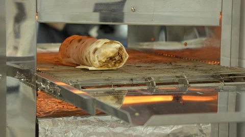 Baking shawarma in a hot oven. Stock Footage 278994816
