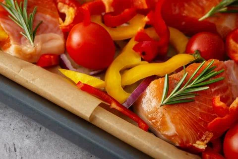Baking sheet with Arctic char and vegetables Stock Photos