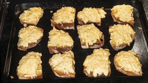 Baking slices of bread with cheese in the oven, time lapse Stock Footage 126056755