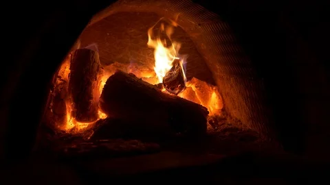 Baking small pizza in a tiny pizza oven, wood fire Stock Footage 113065704