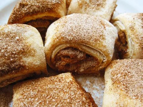 Baking small rolls with cinnamon, vanilla and sugar Stock Photos