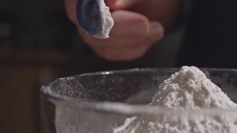Baking soda into flour slow motion Stock Footage 149944932