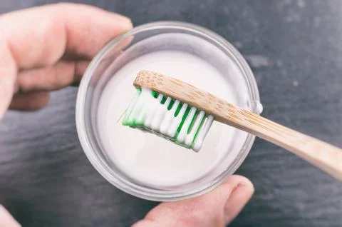 Baking soda paste on a toothbrush Stock Photos