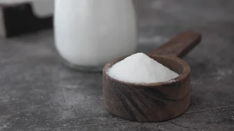 Baking soda powder in a spoon for cleaning Stock Footage 339257988