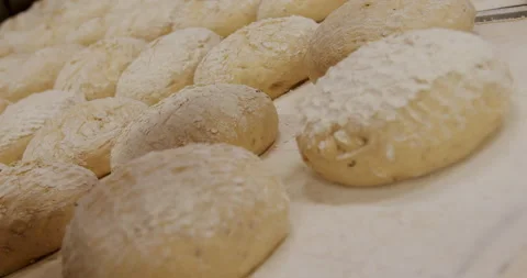 Baking sourdough bread at a bakery 4K. Stock Footage 221565294