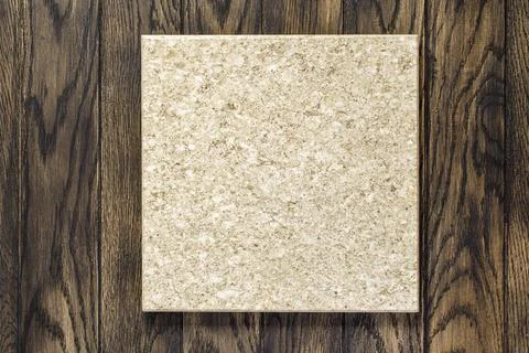 Baking stone made of volcanic tuff for oven on wooden table Fotos de archivo