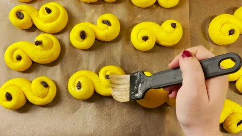 Baking Swedish saffron buns known as Lussebullar for Christmas Stock Footage 166093324