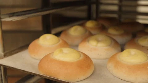 Baking sweet buns. The work of a baker. 스톡 동영상 240217969