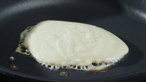 Baking thick pancakes. Work in the kitchen. Stock Footage 277452188