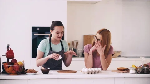 Baking together home dessert kitchen woman friends Video stock 159278796