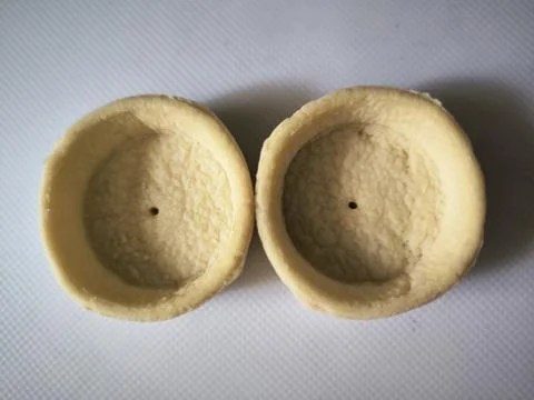 Baking two forms of dough, baskets for filling with filling, food snack Stock Photos