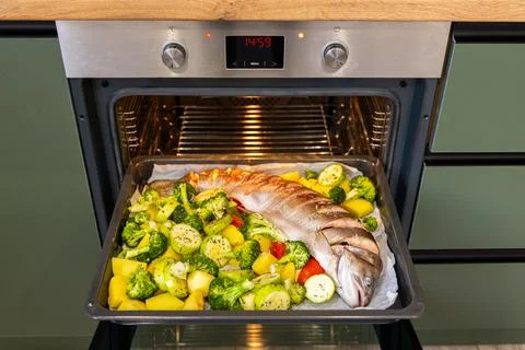 Baking whole trout with vegetables Stock Photos