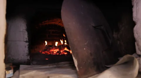 Baking in a wood fired oven Stock Footage 44219652