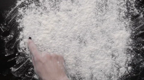 "Baking" written on black board with flour Video stock 60880601
