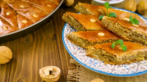 Baklava and Turkish tea on the table. Selective focus. Stock Footage 169350280