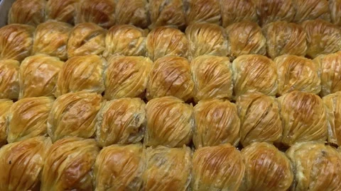 Baklava, dessert made from syrup and honey. Oriental sweets on showcase. Stock Footage 318080853