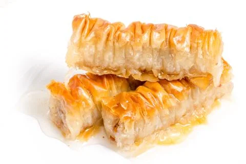 Baklava splashed with chocolate isolated on white background Stock Photos