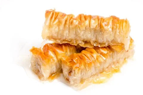 Baklava splashed with chocolate isolated on white background Stock Photos