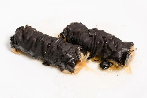Baklava splashed with chocolate isolated on white background Stock Photos