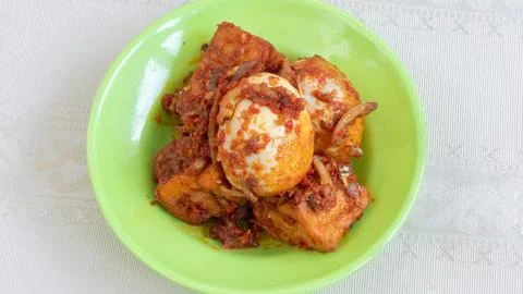 Balado egg sauce, chili sauce filled with eggs, anchovies, and tofu. Served.. Stock Photos