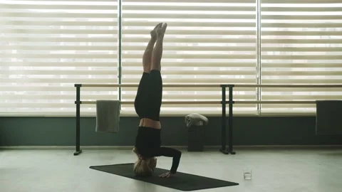 Balance: asana upside down. Advanced yoga Stock Footage 201006463
