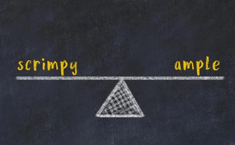 Balance between scrimpy and ample. Chalkboard drawing on black chalkboard 写真素材