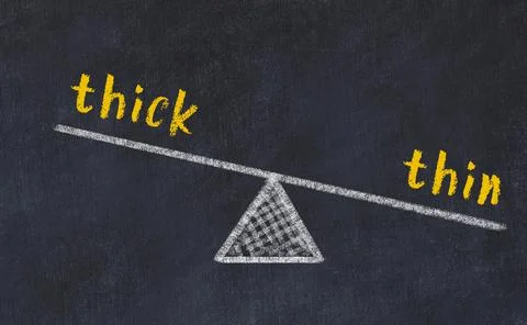 Balance between thick and thin. Chalkboard drawing on black chalkboard Stock Photos