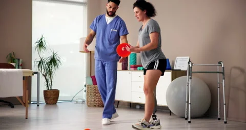 Balance, exercise or prosthetic with patient and physiotherapist in office for Stock Footage 283613524