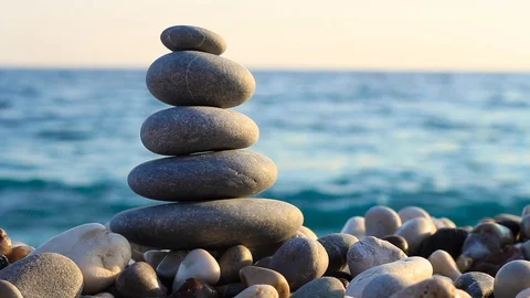Balanced Pebbles Pyramid on the Beach. Stock Footage 129720557