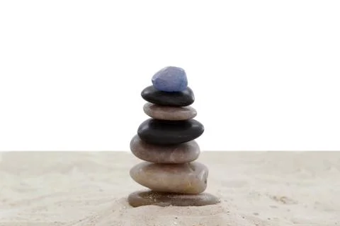 Balanced pebbles on sand Stock Photos