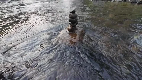 Balanced Rock Cairn in Mountain Stream with Natural Water Flow 4K Stock Footage 337060821