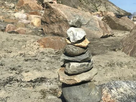Balanced Rock Stack on Sandy Beach Shoreline Stock Photos