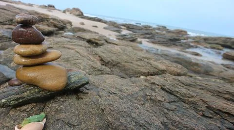 Balanced rocks on the beach Stock Photos