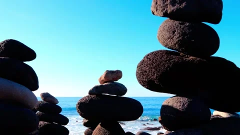 Balanced Stone Stack on Shore with Waves Stock Footage 307909745