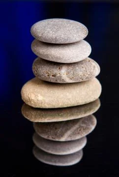Balanced stones with dark shadows Stock Photos