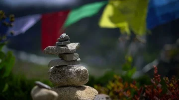Balanced Stones In Front of Prayer Flags,  Everest Base Camp Trek Stock Footage 85630289