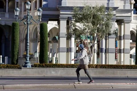 Balancing Act on the Sidewalk's Edge: The Intricate Dance of Urban Life Stock Photos